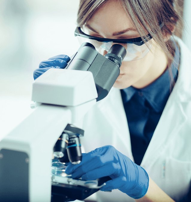 expert looking on microscope